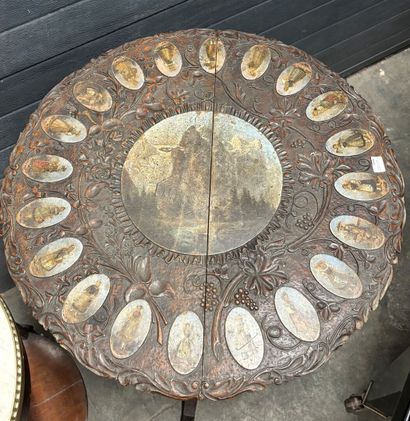 Carved natural wood side table with a painted...
