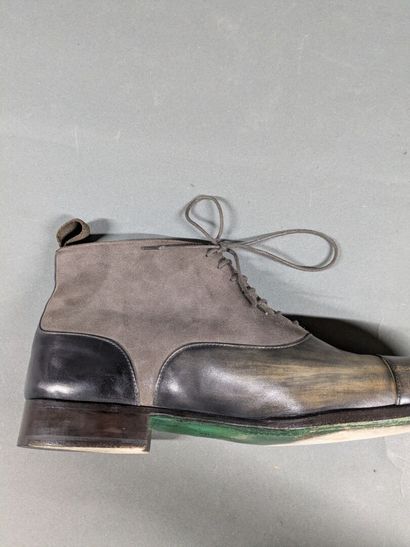 SANTOS
Pair of men's high-top shoes made...
