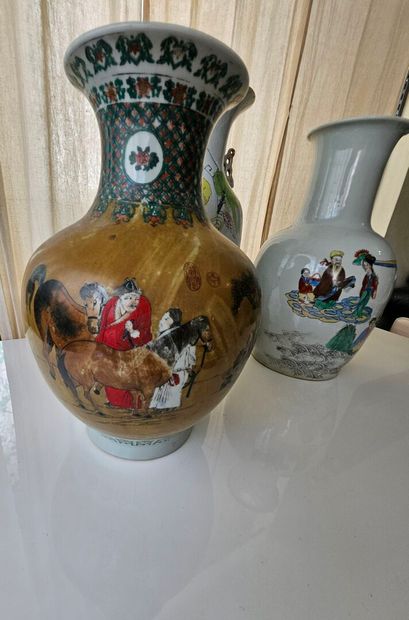 Set of three oval porcelain vases decorated...