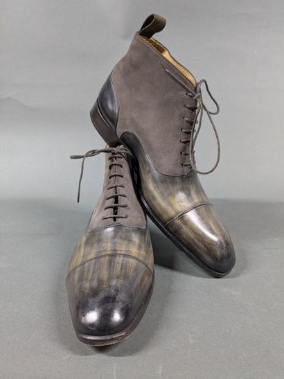 SANTOS
Pair of men's high-top shoes made...