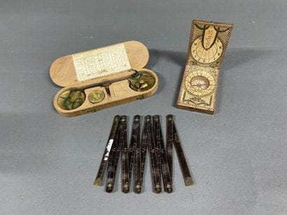 Trebuchet in its box, sundial, and folding...