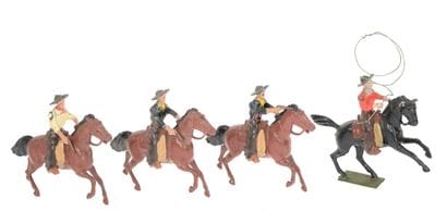 BRITAINS : 4 cavaliers Cow-boys en métal,...