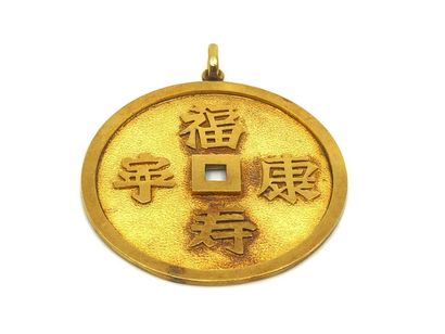 PENDENTIF circulaire en or jaune 750° à motifs...