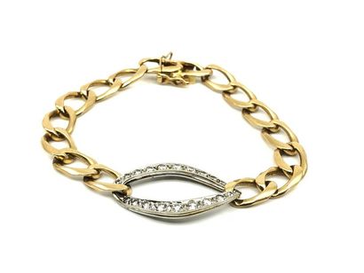 BRACELET gourmette en or jaune 750° ornée...