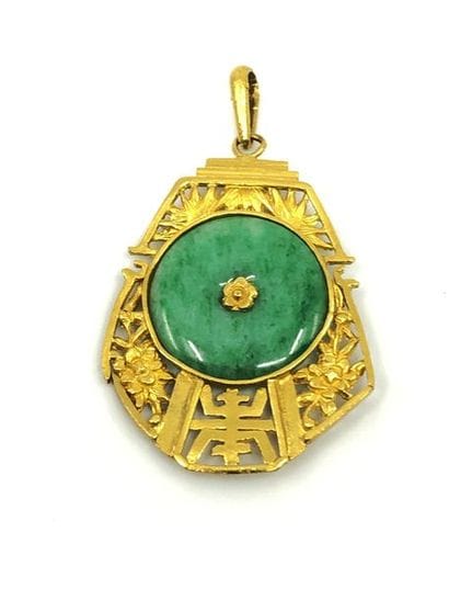 PENDENTIF en or jaune 750° ornée d'un disque...