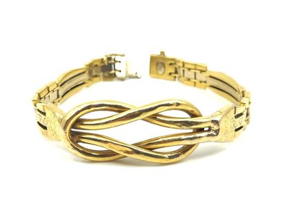 BRACELET en or jaune 750° à motifs d'entrelacs
Poids...
