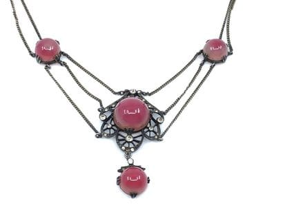 COLLIER 
En vermeil orné de cabochon de couleur...