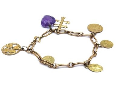 BRACELET gourmette en or jaune 750° et breloques...