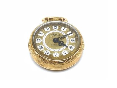 MONTRE DE COL en or jaune 750° finement ciselée...