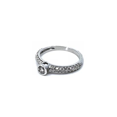 BAGUE 
en or gris 750° ornée d'un diamant...