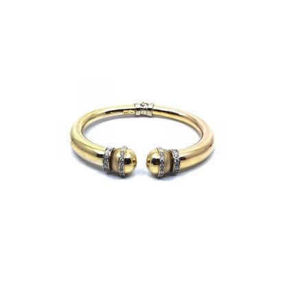 BRACELET 
jonc en or deux tons 750° sertis...