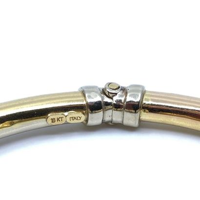 BRACELET 
jonc en or deux tons 750° sertis...
