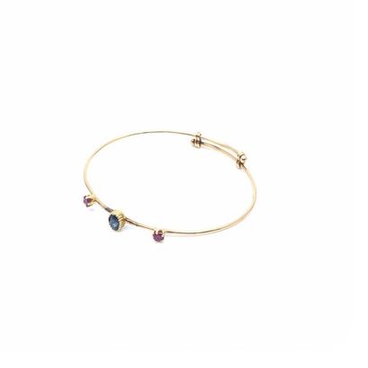 BRACELET 
en or jaune 750° rigide ornée de...