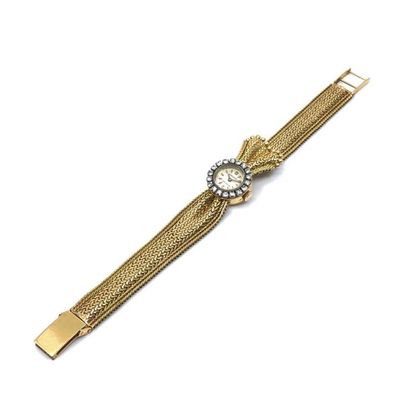 MOVADO
Montre bracelet de dame en or jaune...