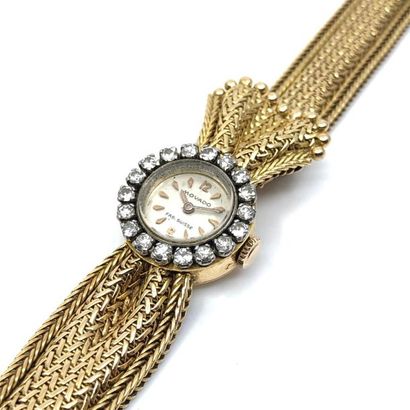 MOVADO
Montre bracelet de dame en or jaune...
