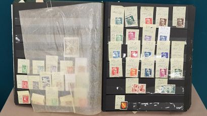 a green album with stamps of France between...