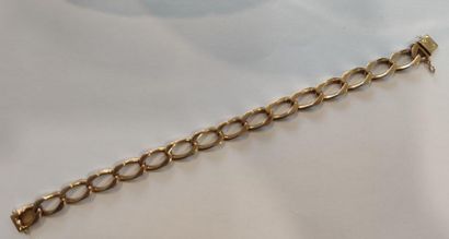 BRACLET maille gourmette en or jaune 750°...