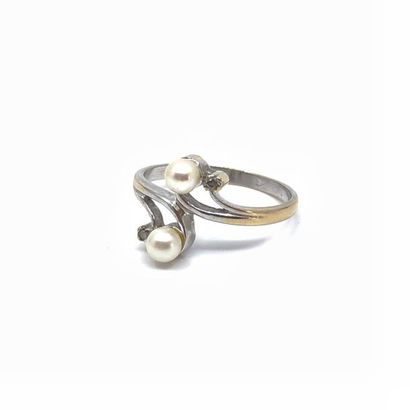 BAGUE Toi et Moi à volutes en or gris 750°...