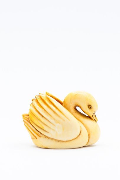 JAPAN 
NETSUKE in carved ivory representing...