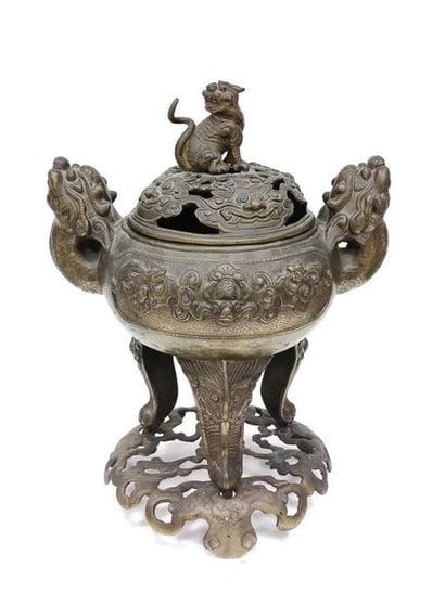 VIETNAM
Bronze perfume burner resting on...