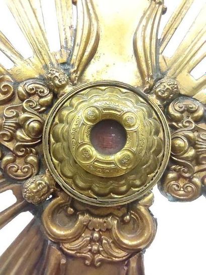 RELIQUARIAN CROSS in gilded metal applied...