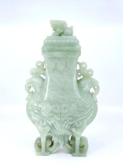 Covered vase in green hard stone in relief...