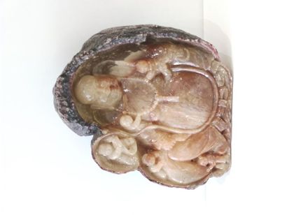 Carved geode of a laughing Buddha 
Asian...