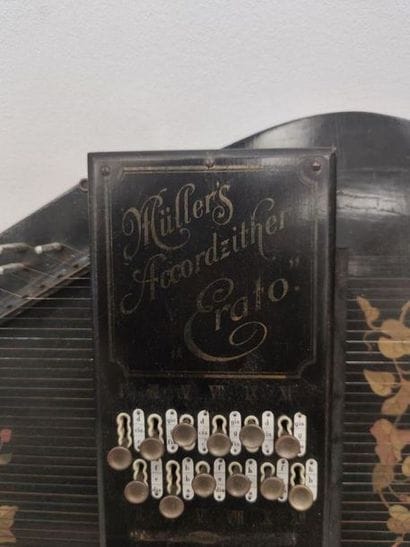MULLERS ACCORDZITHER ERATO 
Blackened wooden...