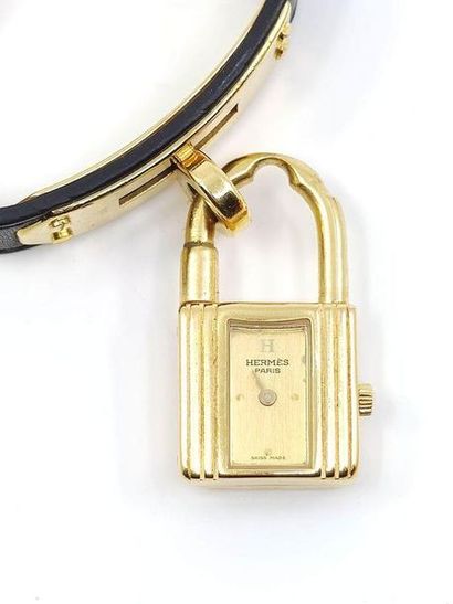 HERMES
Kelly bracelet watch, gold metal padlock,...