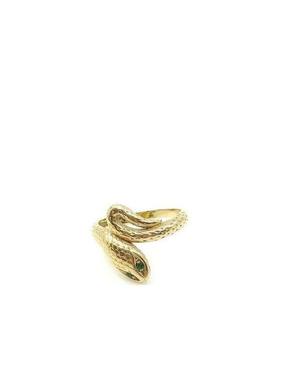 750° yellow gold snake ring with green stones
Gross...