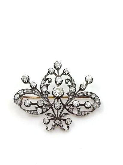 Gold and silver butterfly-shaped brooch decorated...