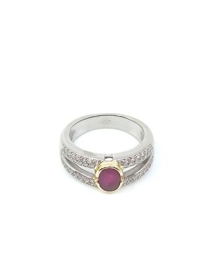 RING in two-tone gold with a ruby in a closed...