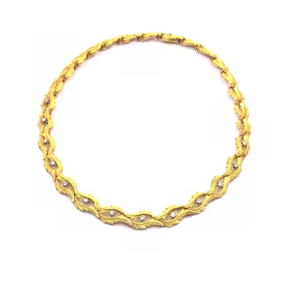 COLLIER en or jaune 750° amati à motifs feuillagés...