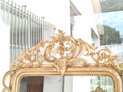 Wood and gilded stucco mantel decorated with...