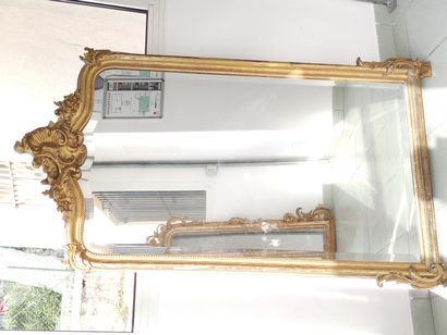Rocaille mantelpiece in wood and gilded stucco...