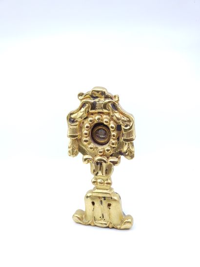 RELIQUARY in gilded wood and stylized containing...
