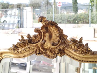 Rocaille mantelpiece in wood and gilded stucco...