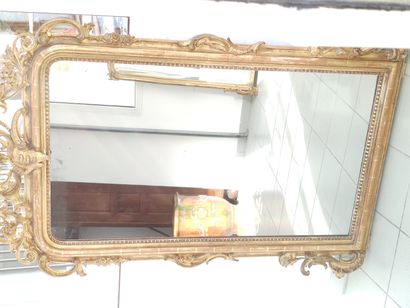 Wood and gilded stucco mantel decorated with...