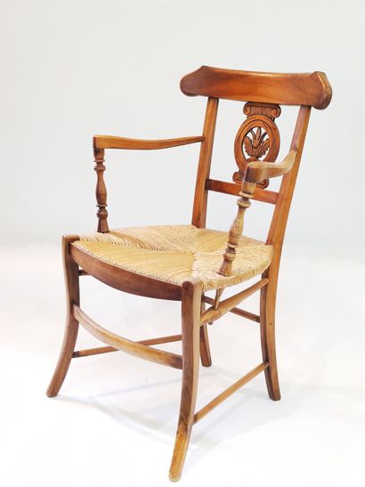 Pair of straw armchairs in carved walnut...