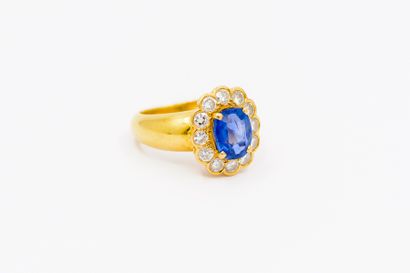 BAGUE marguerite en or jaune 750° ornée d'un...