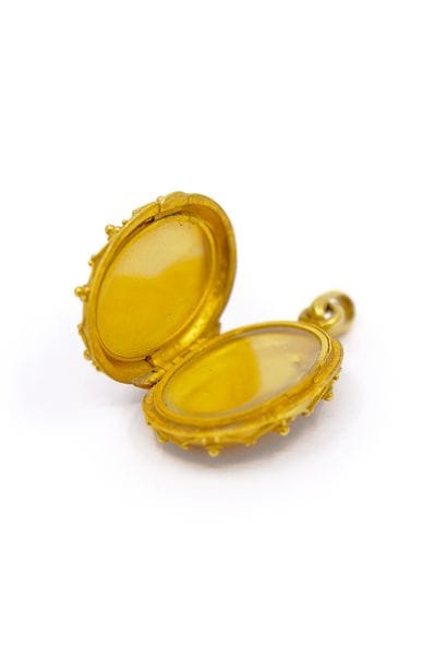 PENDENTIF porte-souvenir en or jaune 750°...