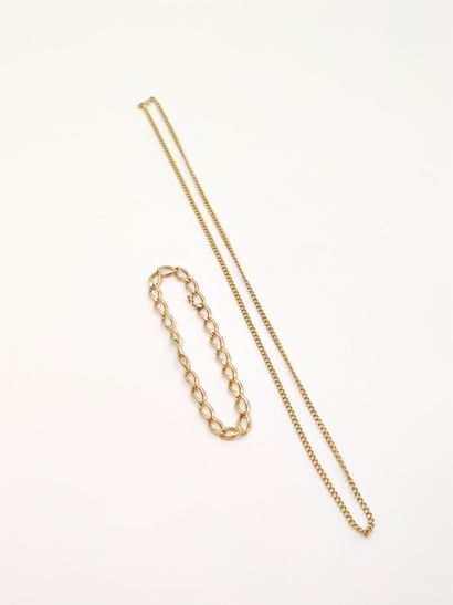 
CHAINE en or jaune 750° et bracelet gourmette...