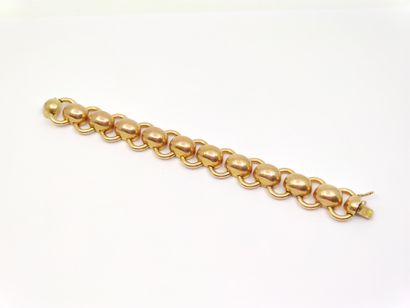 BRACELET en or jaune 750° à maille boules...