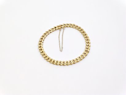 BRACELET gourmette en or jaune 750° avec...