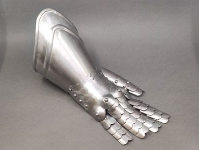 Armour gauntlet. 

Iron, with articulated...