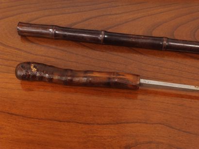 Two sword sticks: one modern and one made...