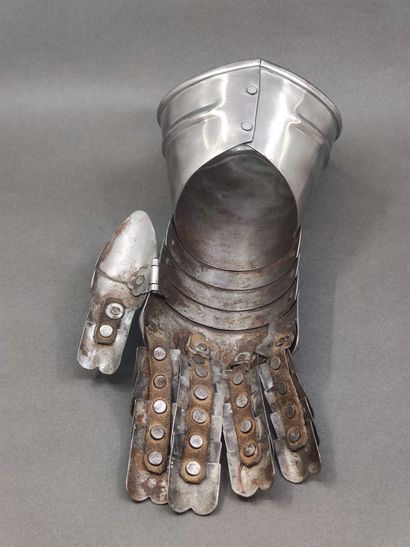 Armour gauntlet. 

Iron, with articulated...