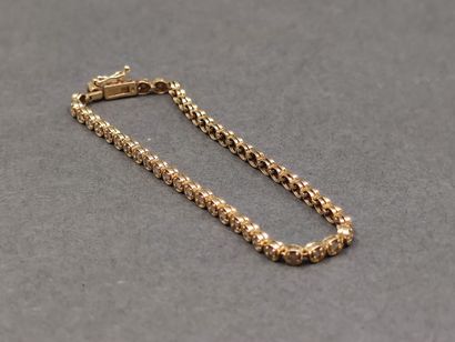 BRACELET rivière en or jaune 750° ornée de...