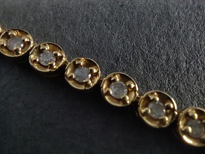 BRACELET rivière en or jaune 750° ornée de...