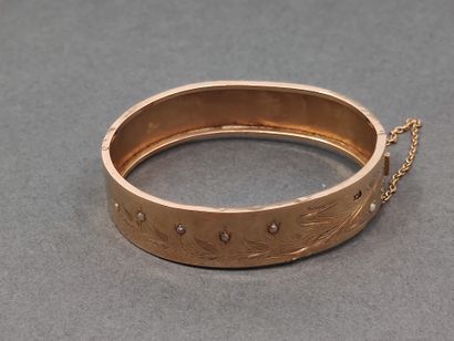 BRACELET jonc en or jaune 750° ouvrant à...